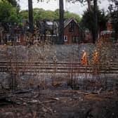 Network rail workers inspect the track and embankment after the Stourbridge wildfire 