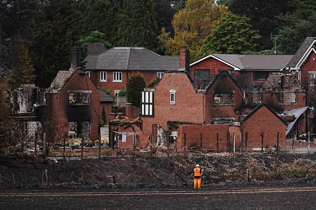 Network rail workers inspect the track and embankment after the Stourbridge wildfire on August 17