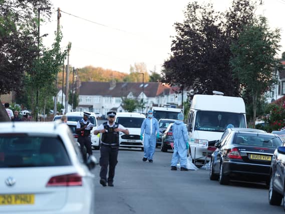 Police at the scene of a fire on Berkeley Avenue in Hounslow in which a 48-year-old woman died and a further eight people were taken to hospital