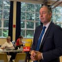 Paul Givan in a school hall