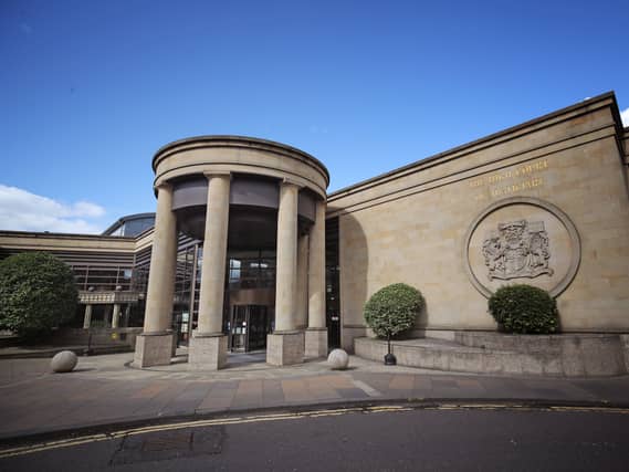Exterior view of the High Court Glasgow under blue skies