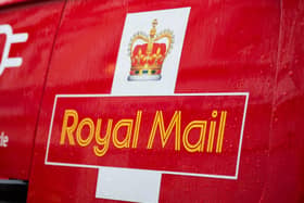 A Royal Mail logo on a van