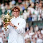 Jannik Sinner holds the Wimbledon trophy