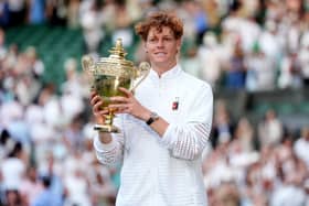 Jannik Sinner holds the Wimbledon trophy
