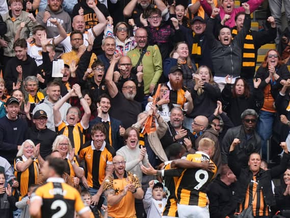 Hull’s Semi Ajayi, centre, celebrates his opening goal with Oli McBurnie in front of the home fans