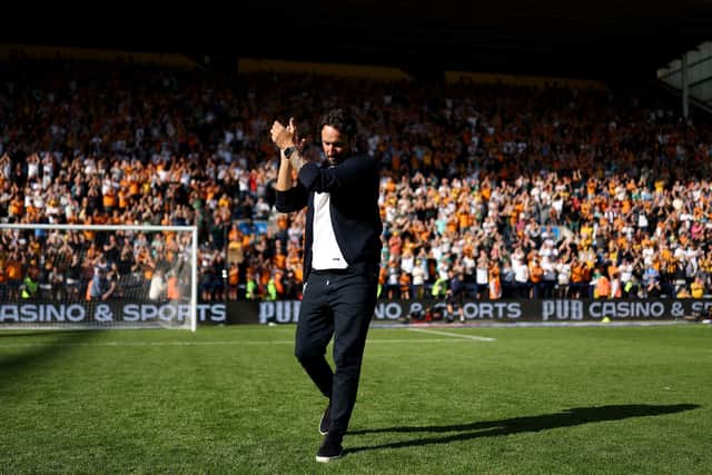 Wolves boss Cesar Peixoto celebrates with Wolves fans