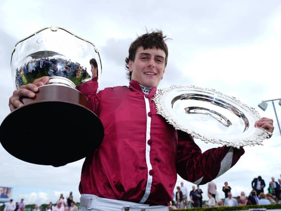 Daniel King with the Galway Plate and Hurdle trophies