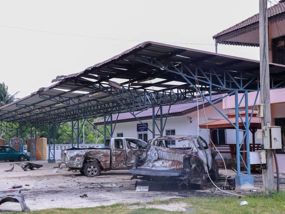 A burned out office and car