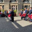 Officials laying wreaths in Edinburgh