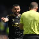 John McGinn of Aston Villa complains to referee Peter Bankes