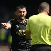 John McGinn of Aston Villa complains to referee Peter Bankes