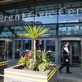 Police officers at the scene of a fatal stabbing at Brent Civic Centre in Wembley, north-west London