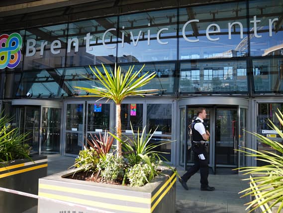 Police officers at the scene of a fatal stabbing at Brent Civic Centre in Wembley, north-west London