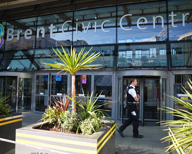 Police officers at the scene of a fatal stabbing at Brent Civic Centre in Wembley, north-west London