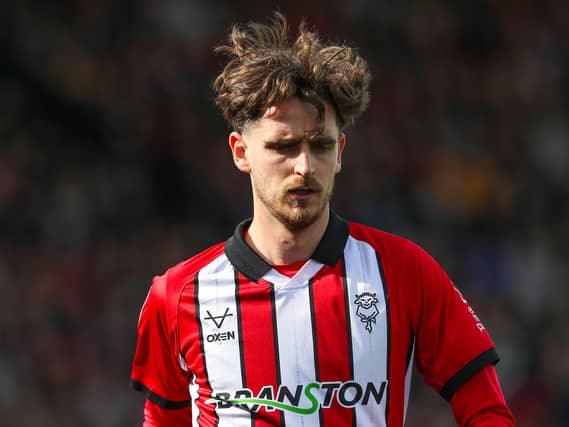 Tom Bayliss in action for Lincoln