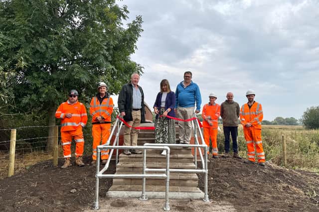 Councillors Hugo Wildblood, Hayley Coles and Andrew Mynors cutting the ribbon on the new Burston Bridge