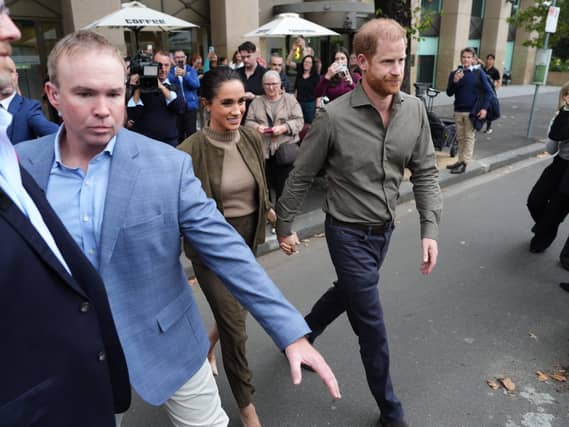 Harry and Meghan with their security