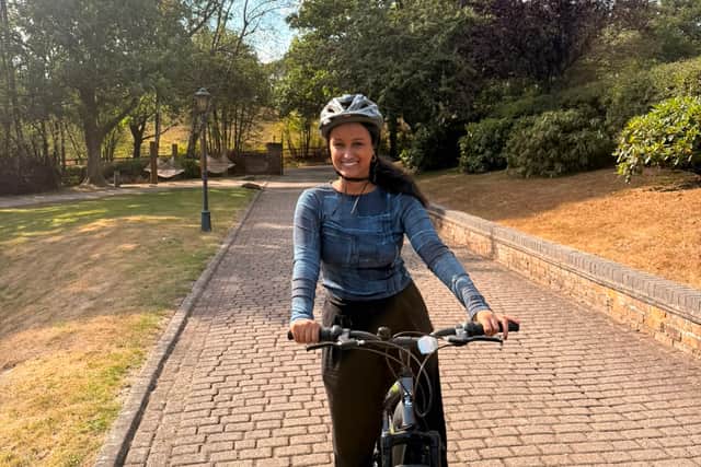 Mimi Ibrahim on a bicycle at Moddershall Oaks Country Spa Retreat