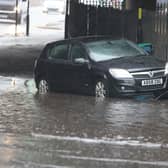 A flooded street in Birmingham as heavy rain arrives in the UK after a prolonged drought. 