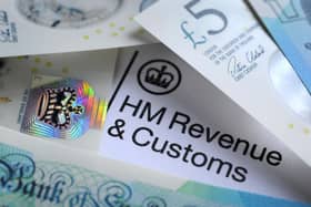 Bank notes surrounding an HMRC letter