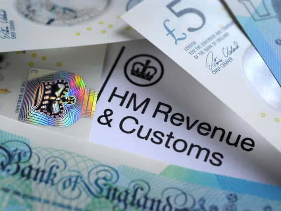 Bank notes surrounding an HMRC letter