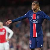 Paris St Germain's Bradley Barcola stands with his arms spread