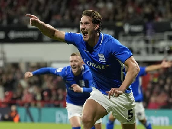 Phil Neumann celebrates