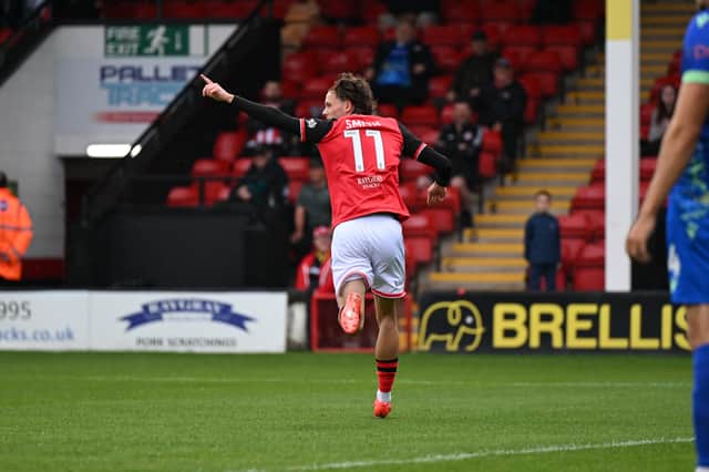 Reece Smith celebrates his first goal for Walsall.