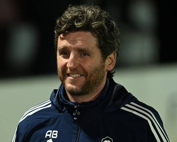 Alex Bruce looks on