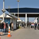 People gather outside the port of Kyrenia