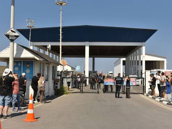 People gather outside the port of Kyrenia