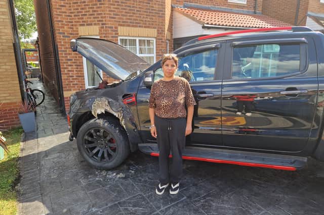 Ranjit Kaur shows the damaged Ford Ranger.