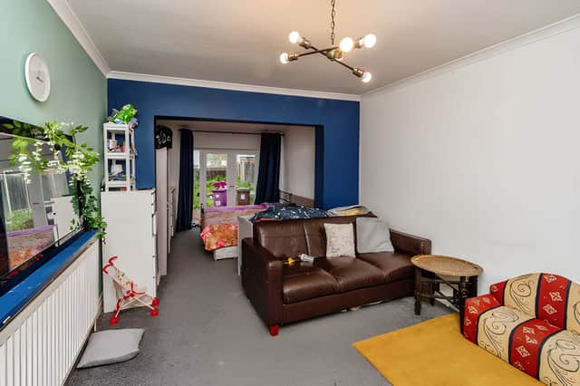The lounge is currently separated from the kitchen by a stud wall, offering flexibility for a future open-plan arrangement