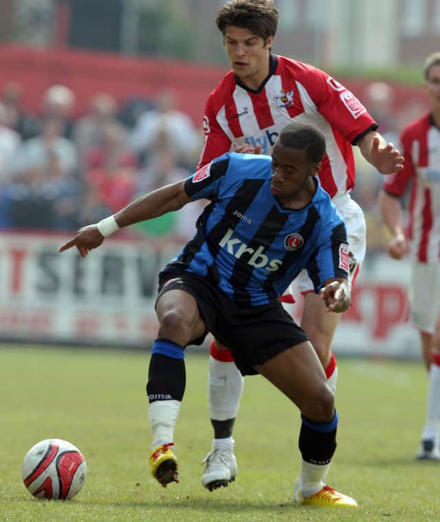 Charlton Athletic's Therry Racon and Exeter City's George Friend in a League One match in 2010