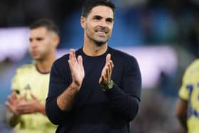 Mikel Arteta smiles and claps at the final whistle
