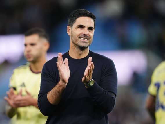 Mikel Arteta smiles and claps at the final whistle