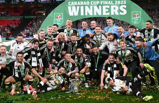 Newcastle celebrate with the Carabao Cup at Wembley Stadium - Sean Neave is back row, second from the right, while recent Wolves signing Kieran Trippier is crouching behind the trophy at the front