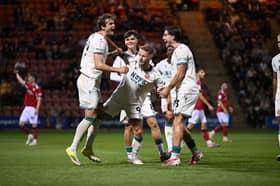 Aaron Pressley is mobbed by his team-mates