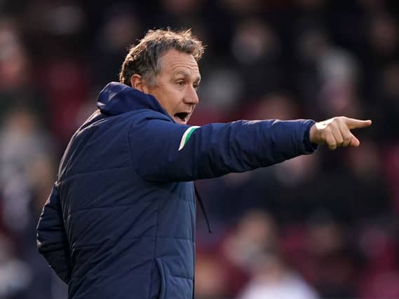 Micky Mellon looks on