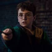 A scene from the new Harry Potter film showing the young wizard waving his wand