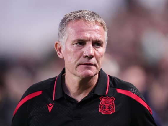 Phil Parkinson looks on