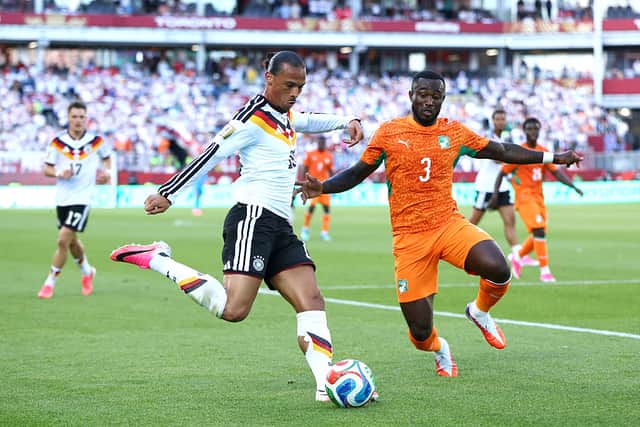 Ghislain Konan (right) chases down Germany's Leroy Sane during the recent 2026 World Cup (Photo by Robert Cianflone/Getty Images)