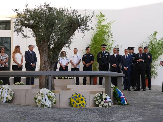 People at a memorial to those killed in a crash in Lisbon