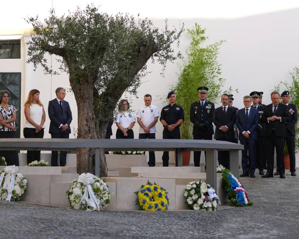 People at a memorial to those killed in a crash in Lisbon