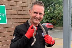 Members of Red Watch came to the reptile's rescue and used specialist ring-cutting equipment to carefully free it