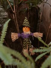 A festive Halloween scarecrow doll