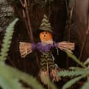 A festive Halloween scarecrow doll 