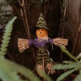 A festive Halloween scarecrow doll 