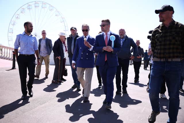 Dan Jukes pictured with Reform UK leader Nigel Farage in Clacton during the 2024 election