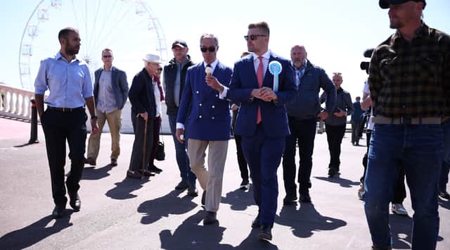 Dan Jukes pictured with Reform UK leader Nigel Farage in Clacton during the 2024 election